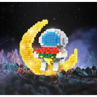 Конструктор с подсветкой астронавт на луне с цветами.